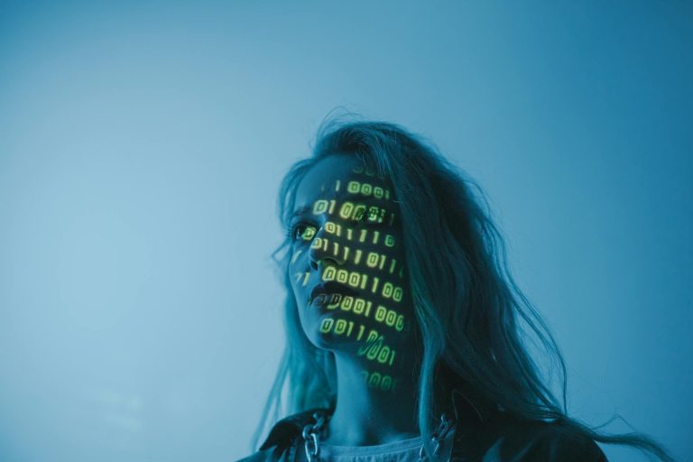 Person reflecting alone with a projection of binary code on her face representing existential anxiety AI and automation