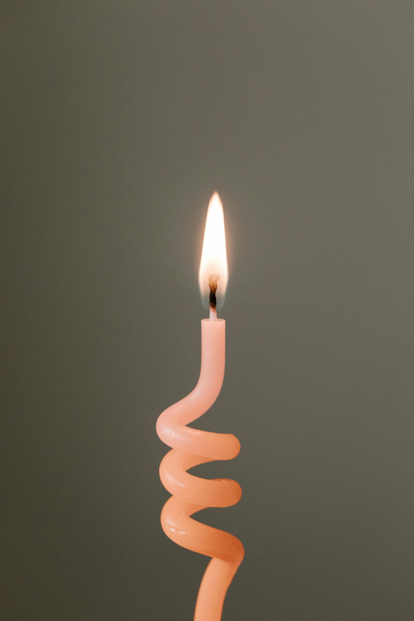 A spiral-shaped candle representing energy rising through the spine in kundalini awakening